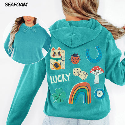 Teal hoodie with lucky charm designs on a white background