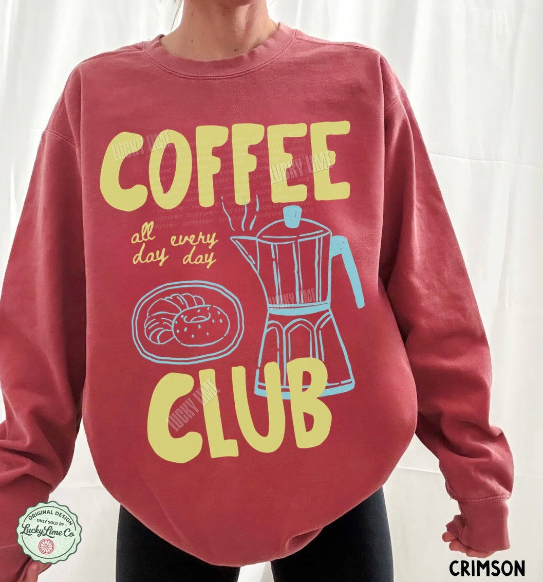 Red sweatshirt with 'Coffee Club' design and text on a white background