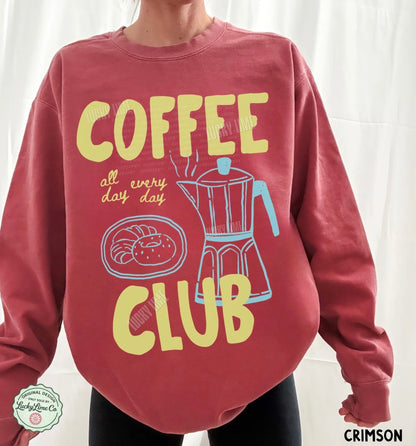 Red sweatshirt with 'Coffee Club' design and text on a white background