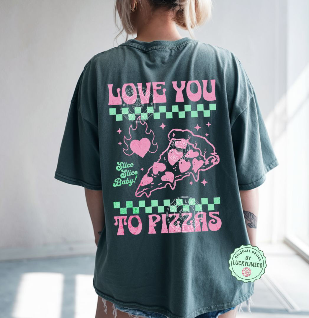 Person wearing a blue spruce t-shirt with pink graphics and text on the back saying “love you to pizzas”