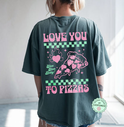 Person wearing a blue spruce t-shirt with pink graphics and text on the back saying “love you to pizzas”