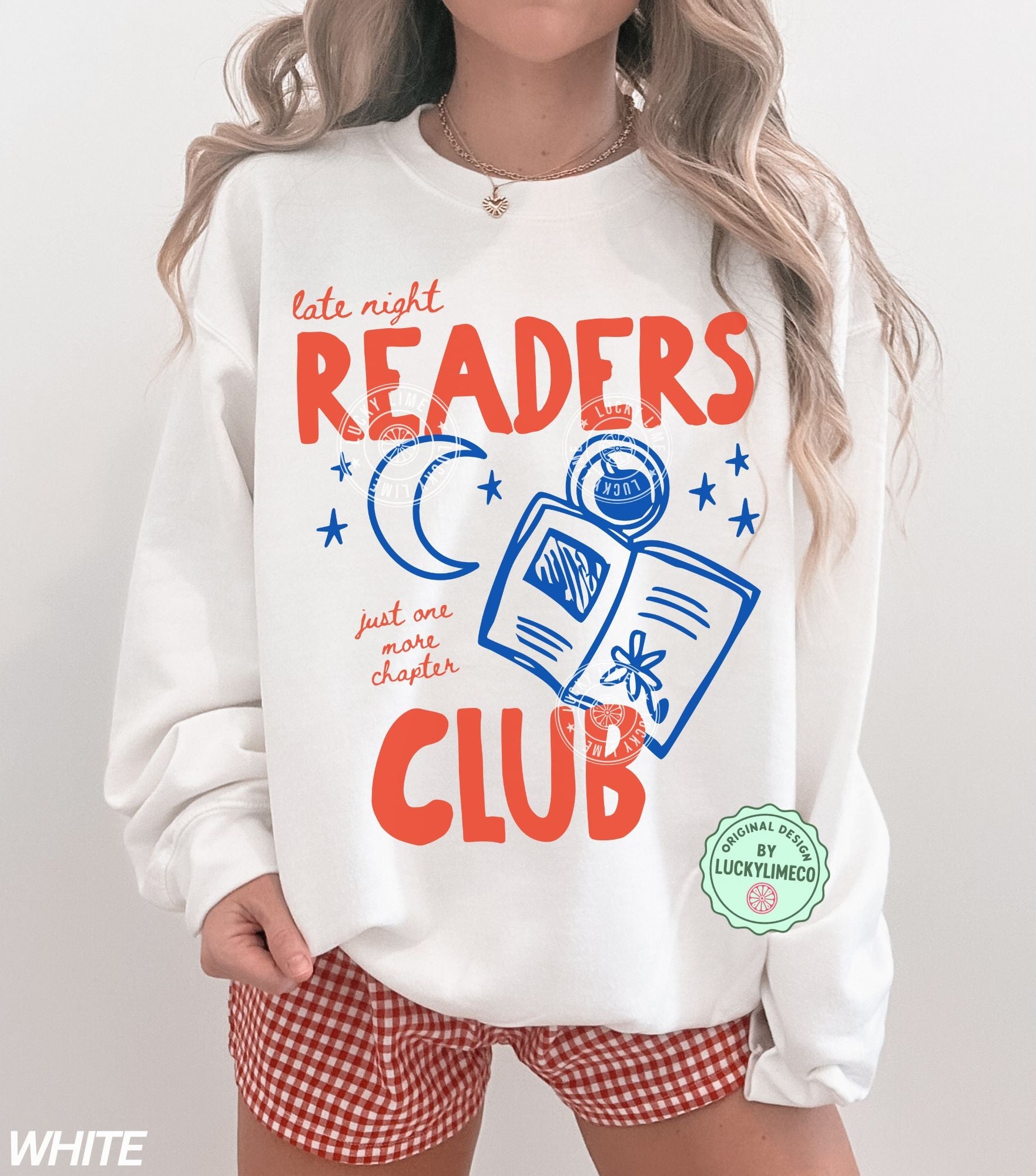 Person wearing a white sweatshirt with 'Late Night Readers Club' design and red checkered shorts.