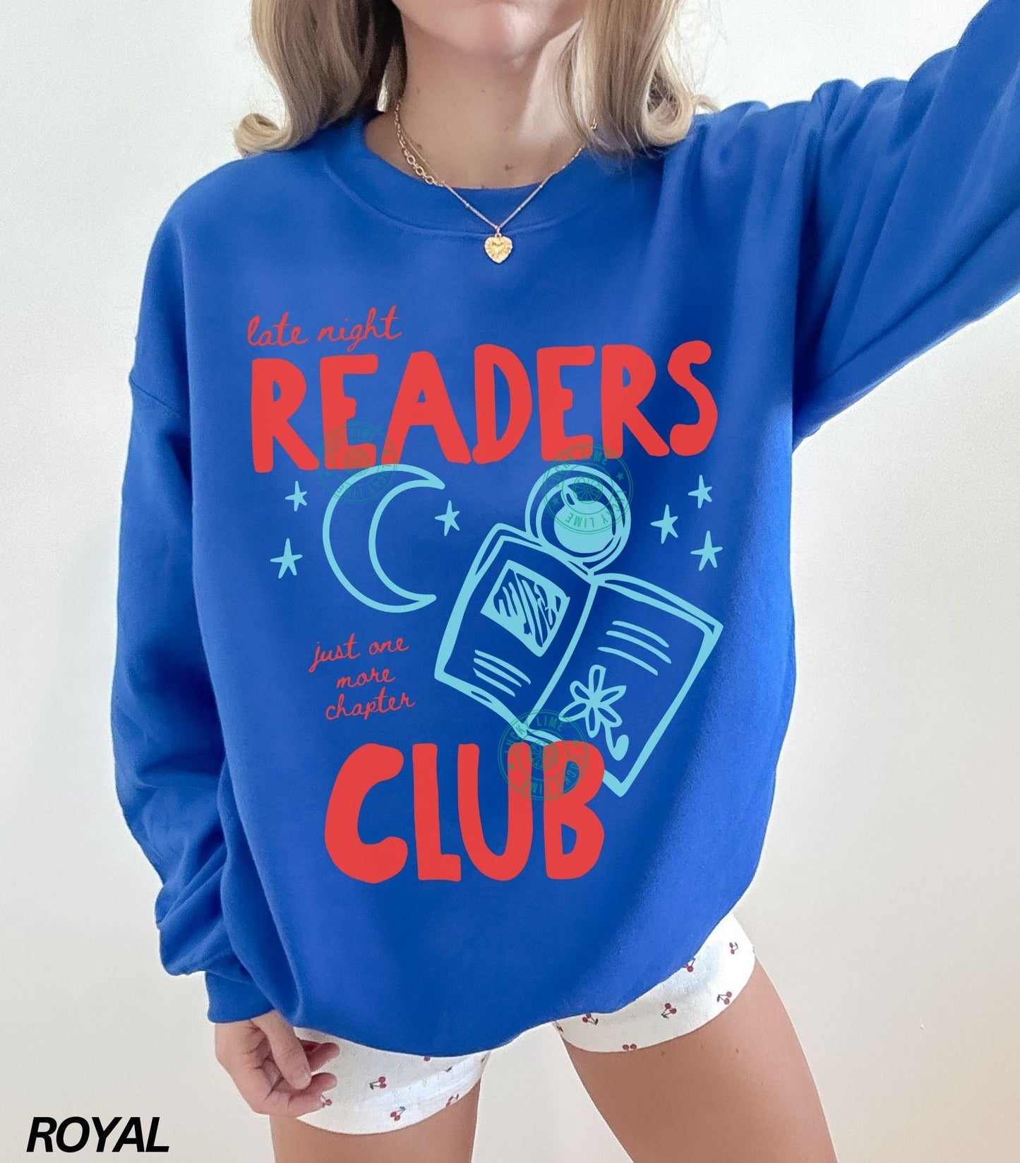 Royal Blue sweatshirt with 'Late night readers club' text and graphics on a plain background