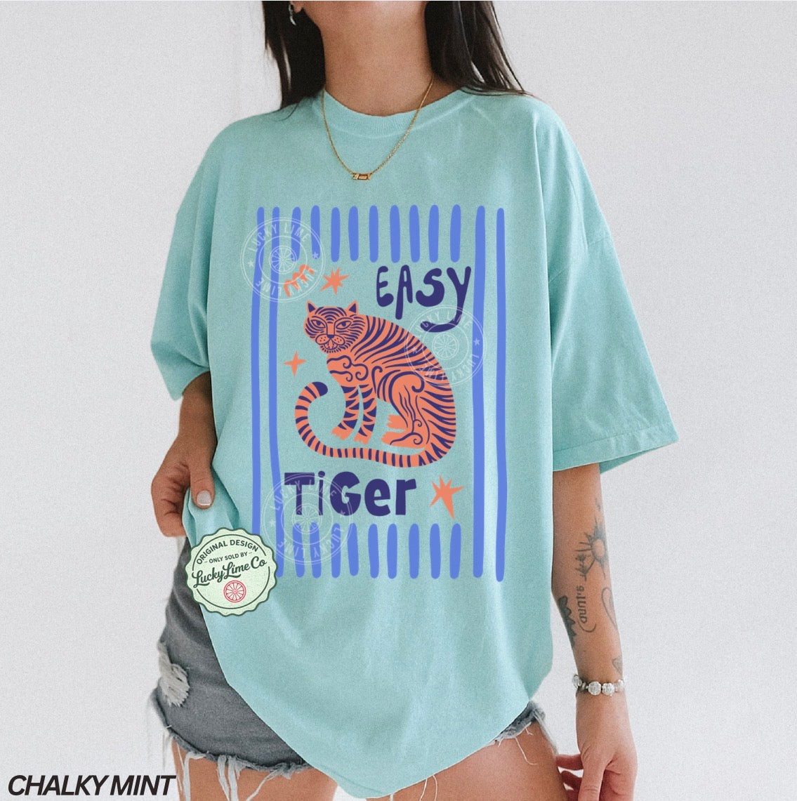Light blue t-shirt with tiger graphic and 'Easy Tiger' text on a plain background