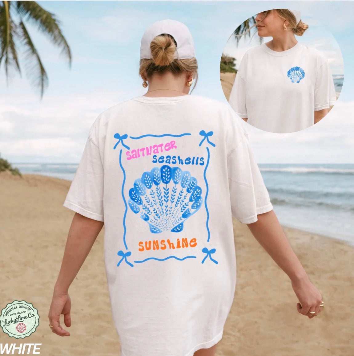 Woman wearing a white t-shirt with a shell design and text on a beach.