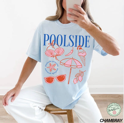 Person wearing a light blue t-shirt with poolside graphics and text.