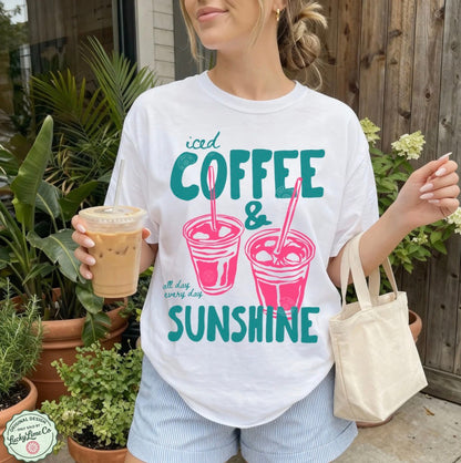 Girl wearing a white shirt with “iced coffee and sunshine’ graphic