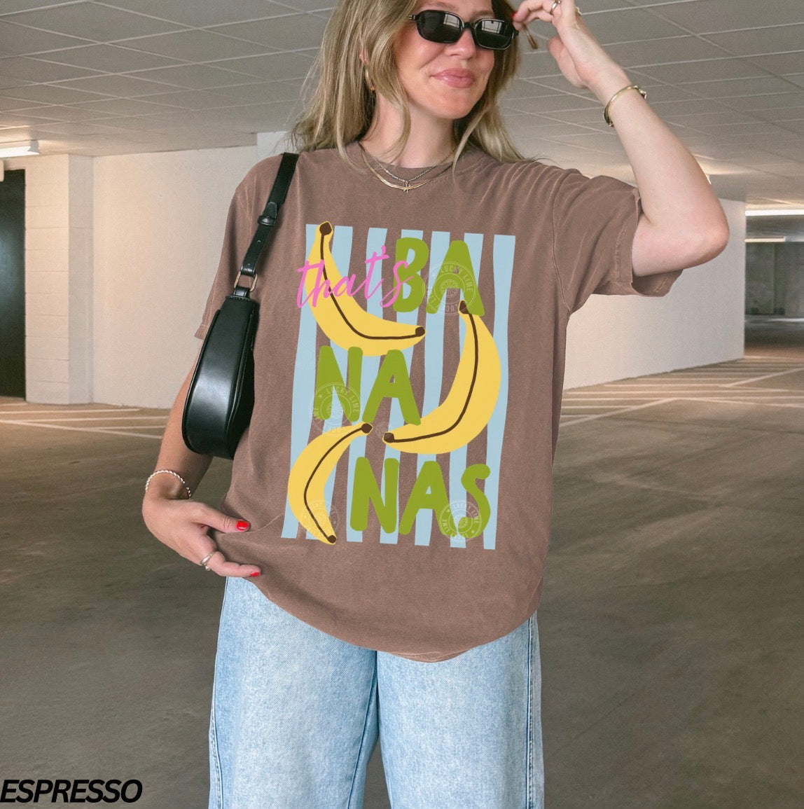 Girl wearing a brown shirt that says “that’s bananas” 