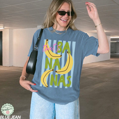 Girl wearing a blue shirt that says “that’s bananas”