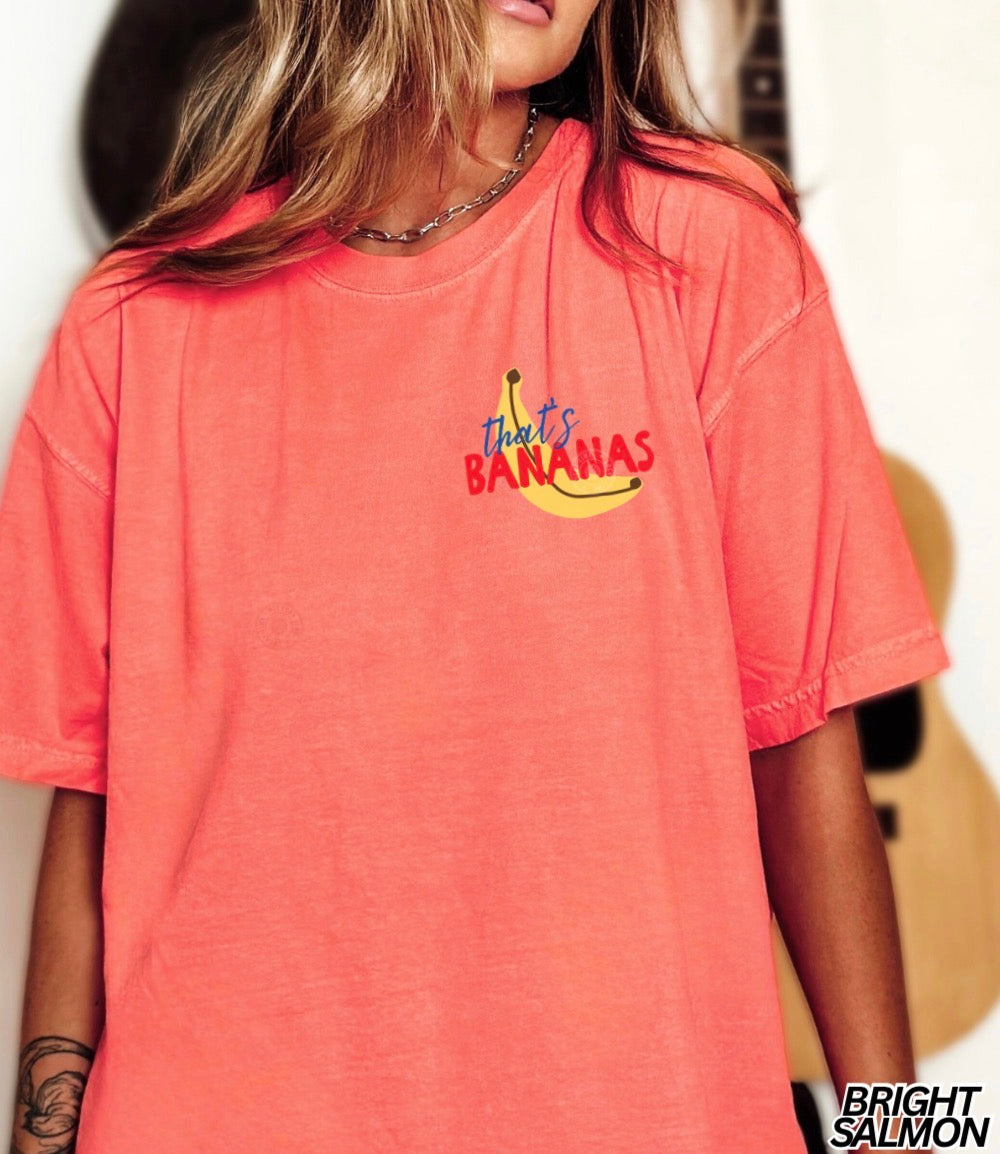 Person wearing a coral t-shirt with 'That's Bananas' graphic design.