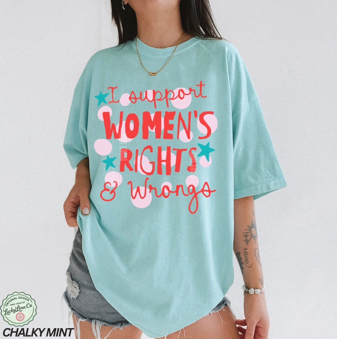 Person wearing a light blue t-shirt with text 'I support WOMEN'S RIGHTS & Wrongs' on a plain background