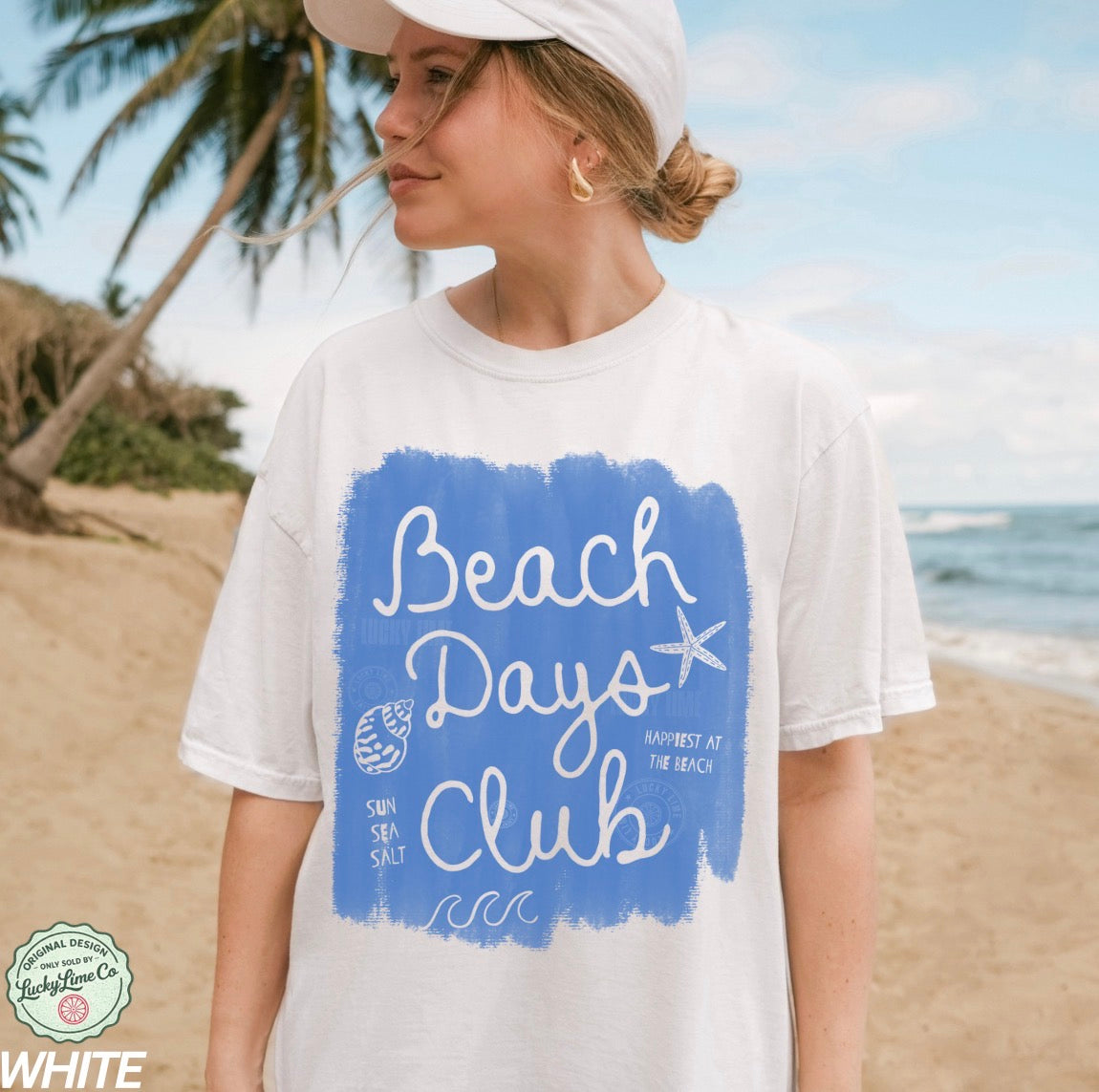 Woman wearing a 'Beach Days Club' t-shirt on a beach