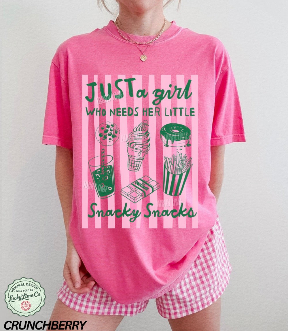 Person wearing a pink t-shirt with snack-themed design and matching shorts.