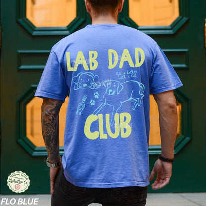 Person wearing a blue t-shirt with 'Lab Dad Club' text and graphics.