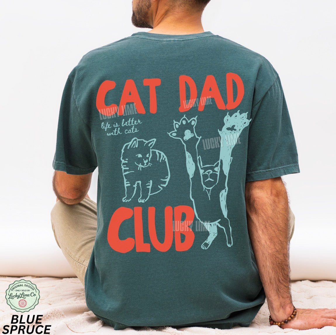 Person wearing a t-shirt with 'Cat Dad Club' design on the back