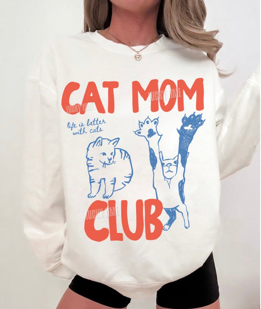 White sweatshirt with 'Cat Mom Club' text and cat illustrations on a white background