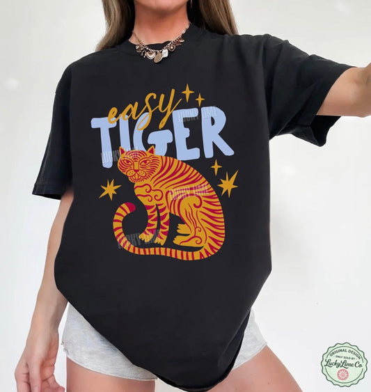 Black t-shirt with a tiger graphic and 'easy tiger' text on a white background