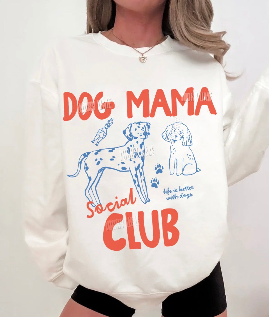 White sweatshirt with 'Dog Mama Social Club' text and dog illustrations on a white background