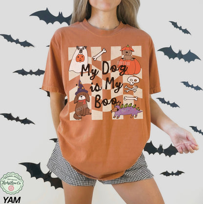 Person wearing a Halloween-themed t-shirt with graphics and text on a white background with bats.