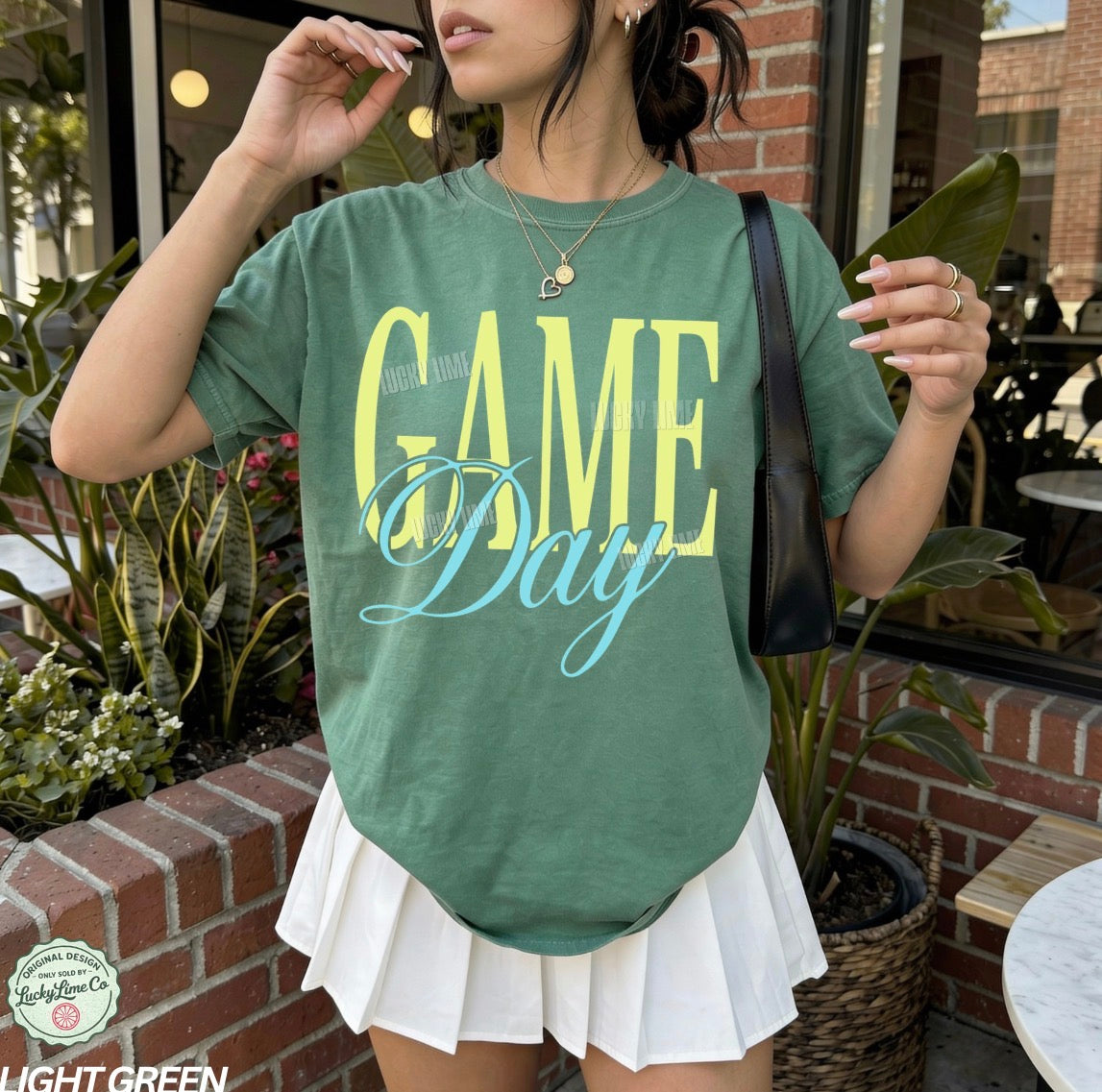 Woman wearing a green tshirt with the words “Game Day”