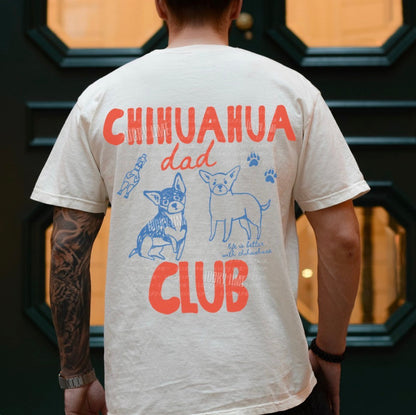 Person wearing a t-shirt with 'Chihuahua dad club' design on the back.