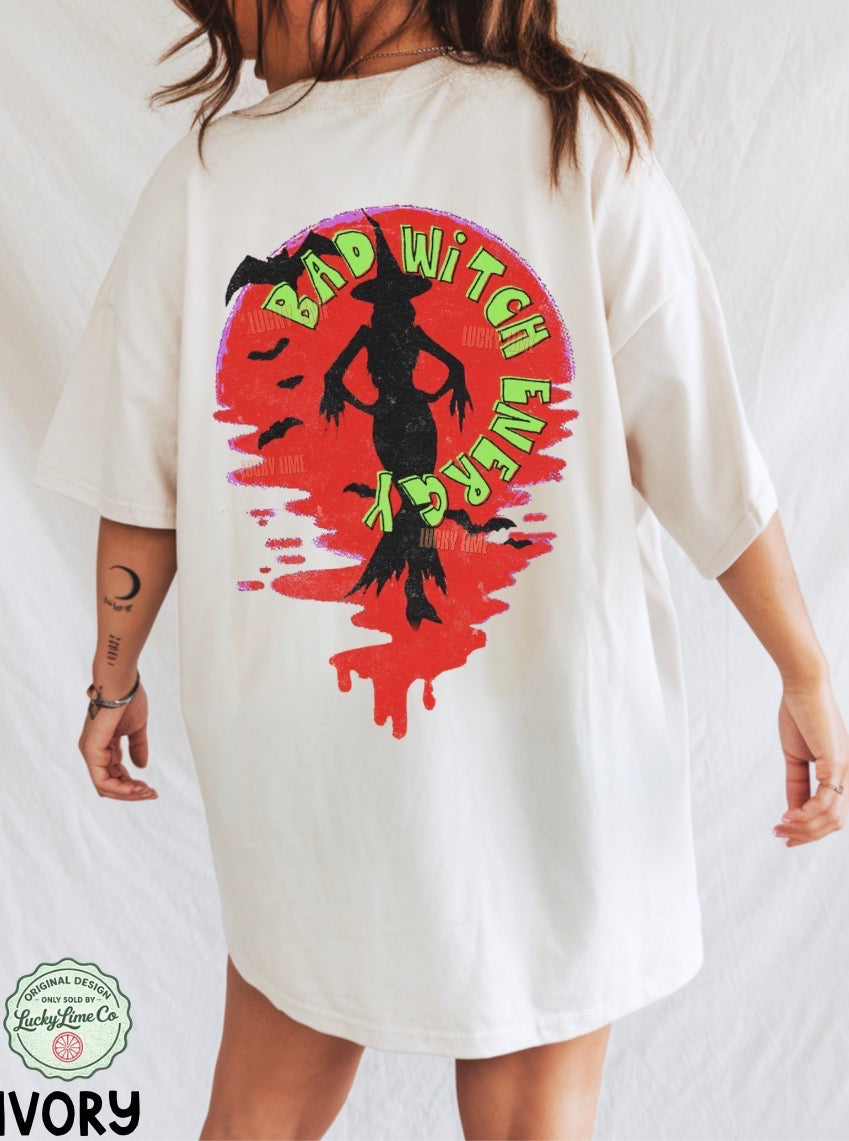 White t-shirt with a colorful 'Bad Witch Ever' design on a plain background