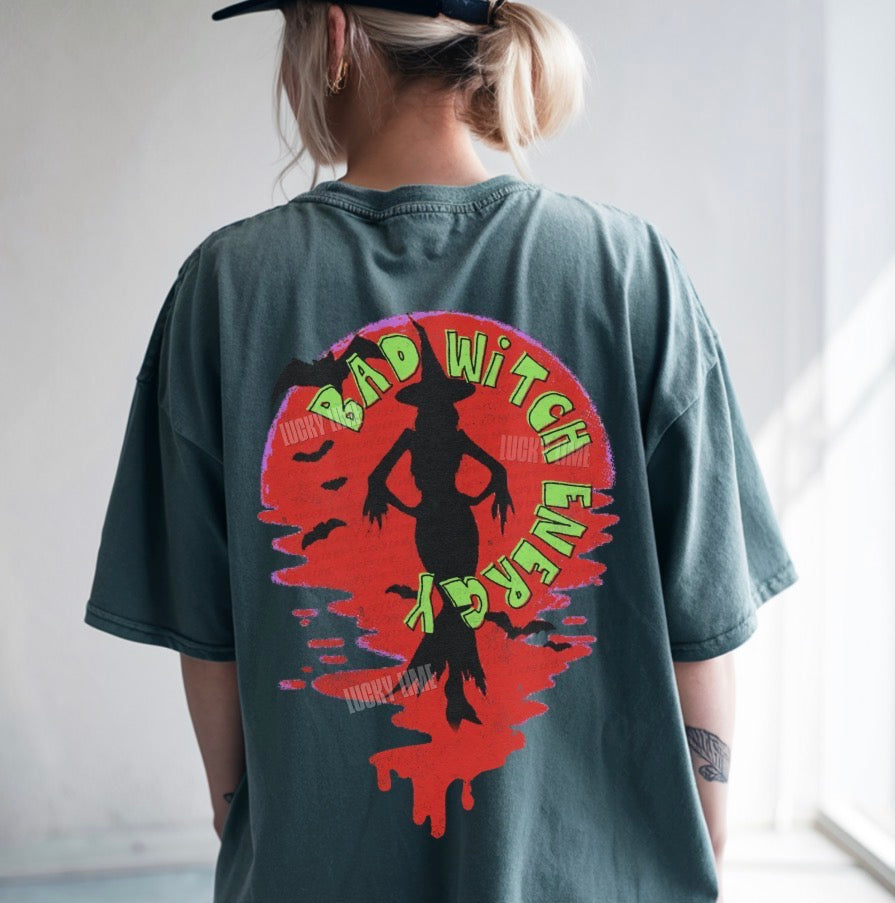 Person wearing a t-shirt with a graphic design and text on the back.