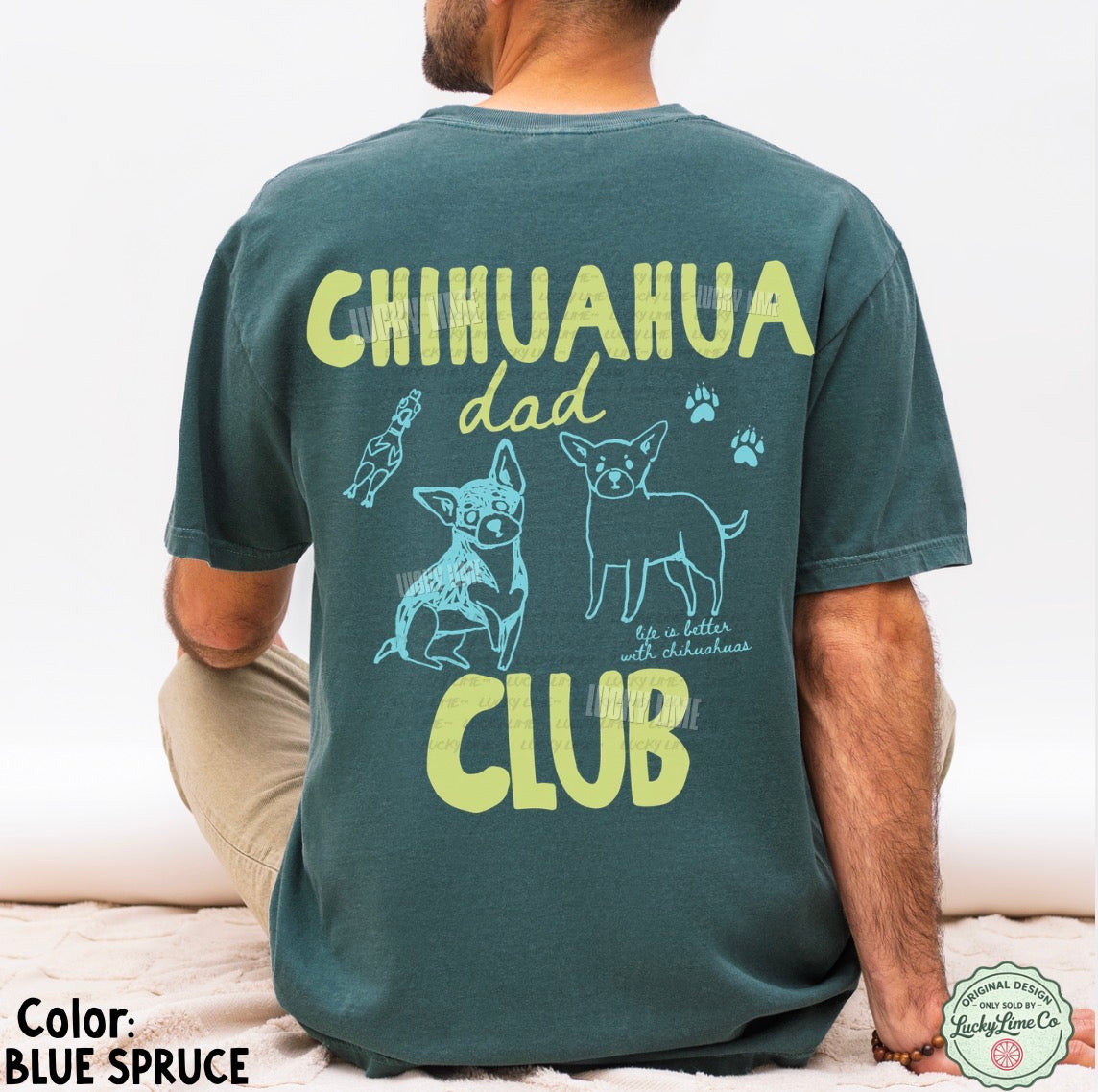 Person wearing a t-shirt with 'Chihuahua dad club' text and graphics on the back.