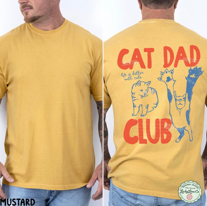 Yellow t-shirt with 'Cat Dad Club' text and cat illustrations on a white background
