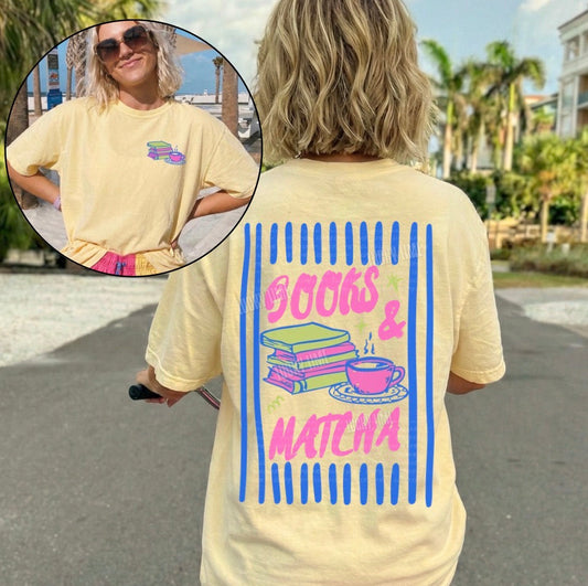 Person wearing a yellow t-shirt with 'Books & Matcha' design outdoors.
