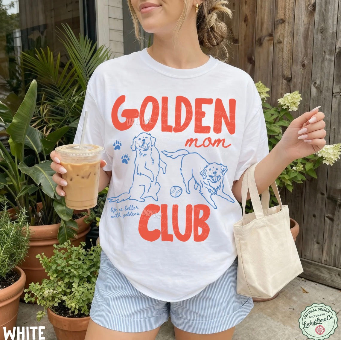 Woman wearing a 'Golden Mom Club' t-shirt, holding iced coffee and a tote bag, standing outdoors.