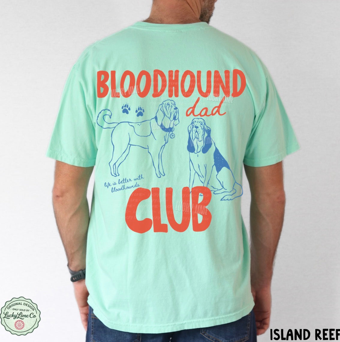 Mint green t-shirt with 'Bloodhound Dad Club' text and dog illustrations on the back, worn by a person.