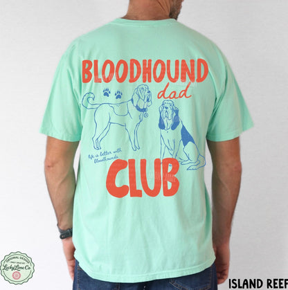 Mint green t-shirt with 'Bloodhound Dad Club' text and dog illustrations on the back, worn by a person.