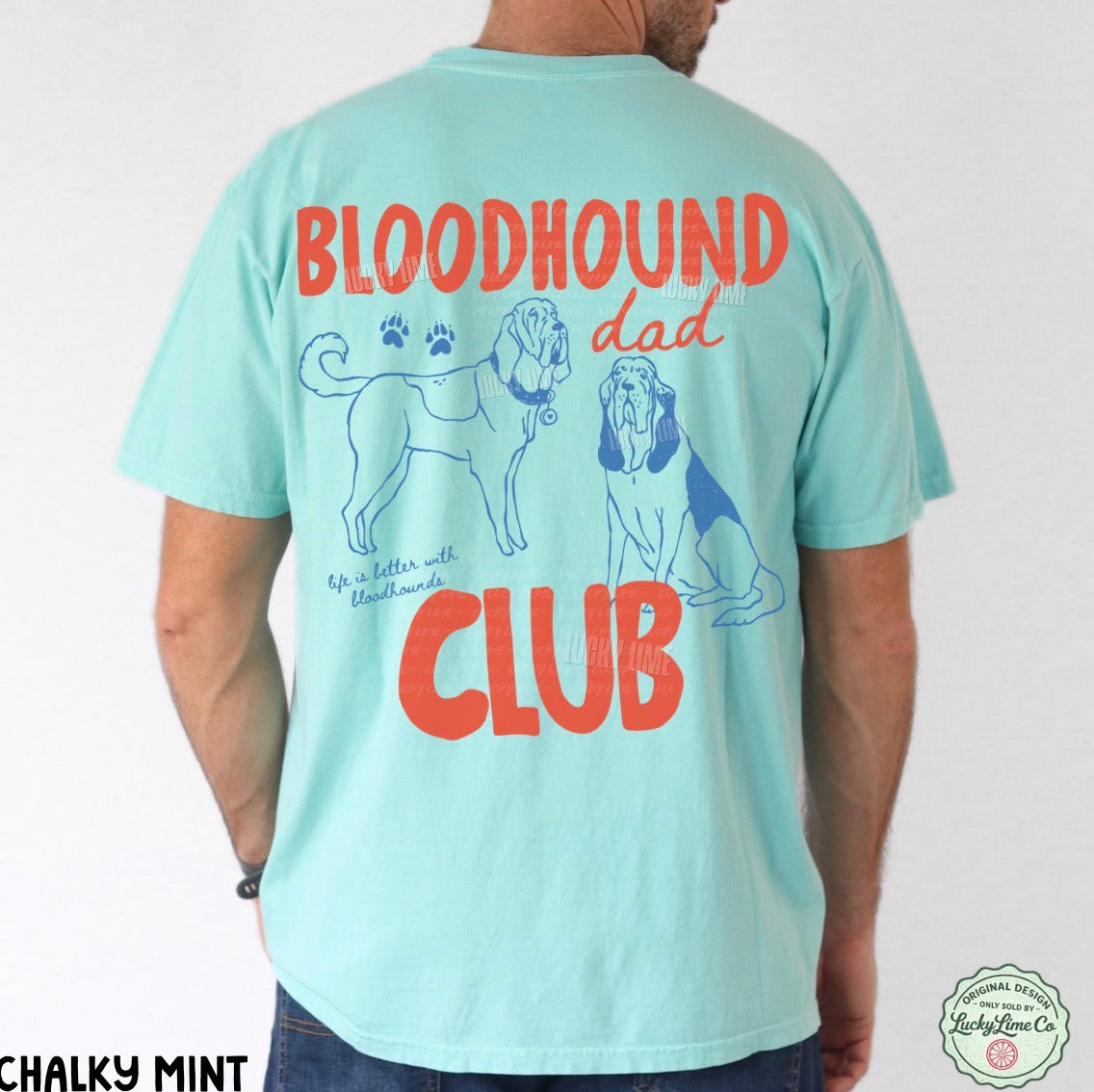 Light blue t-shirt with 'Bloodhound Dad Club' text and dog illustrations on a white background