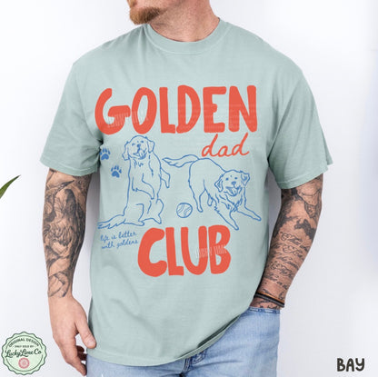 Man wearing a light green t-shirt with 'Golden Dad Club' text and dog illustrations.