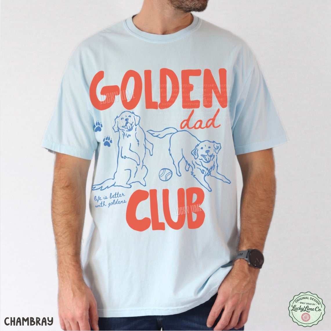 Person wearing a light blue t-shirt with 'Golden Dad Club' text and dog illustrations.