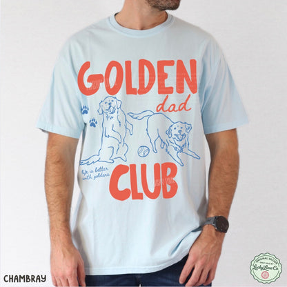 Person wearing a light blue t-shirt with 'Golden Dad Club' text and dog illustrations.