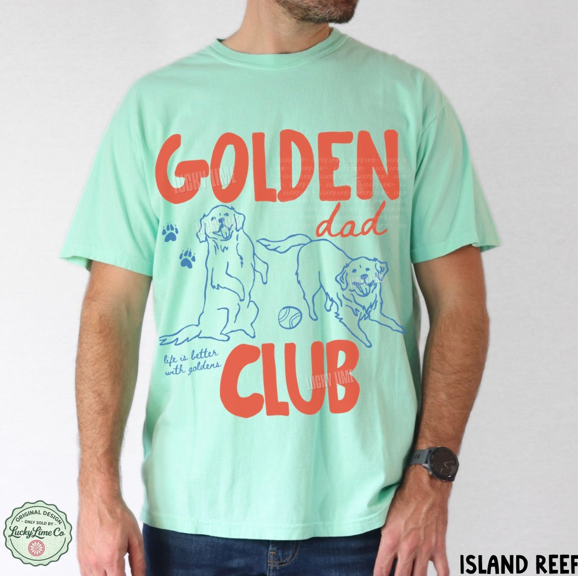 Person wearing a light green t-shirt with 'Golden Dad Club' text and graphics on a white background.