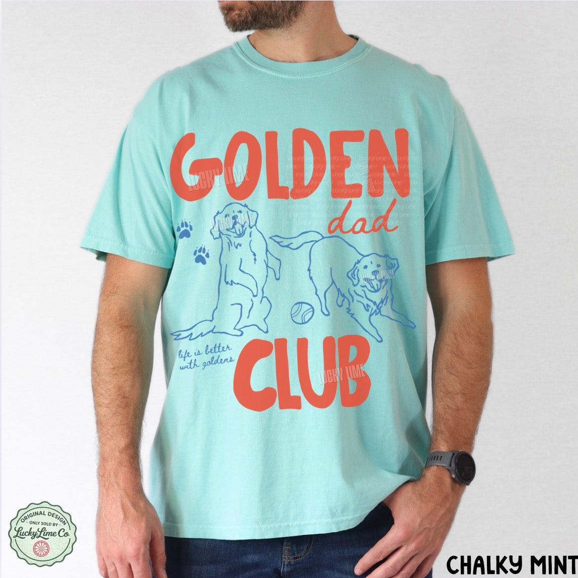 Person wearing a light blue t-shirt with 'Golden Dad Club' text and graphics on a white background.