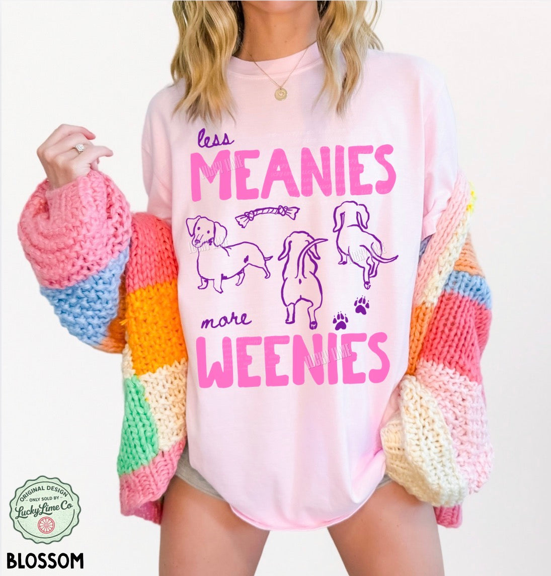 Person wearing a colorful sweater with a graphic design and text on a white background