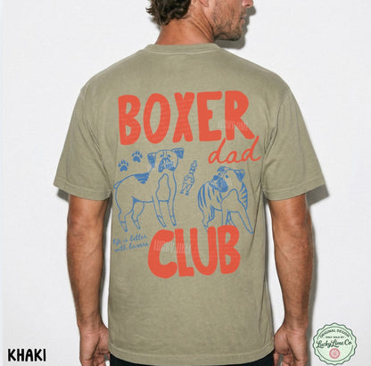 Khaki t-shirt with 'Boxer Dad Club' text and graphics on the back, worn by a person.