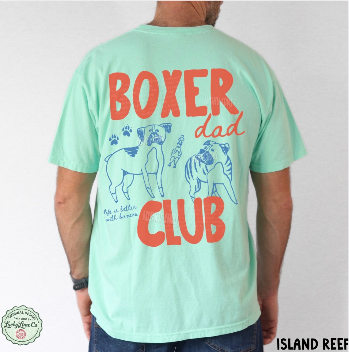 Light green t-shirt with 'Boxer Dad Club' text and dog illustrations on a plain background