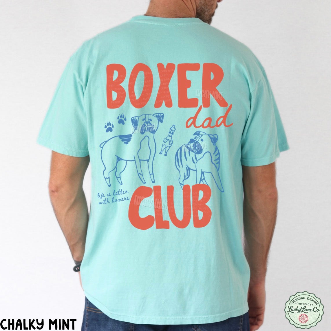 Light blue t-shirt with 'Boxer Dad Club' text and graphics on the back, worn by a person.