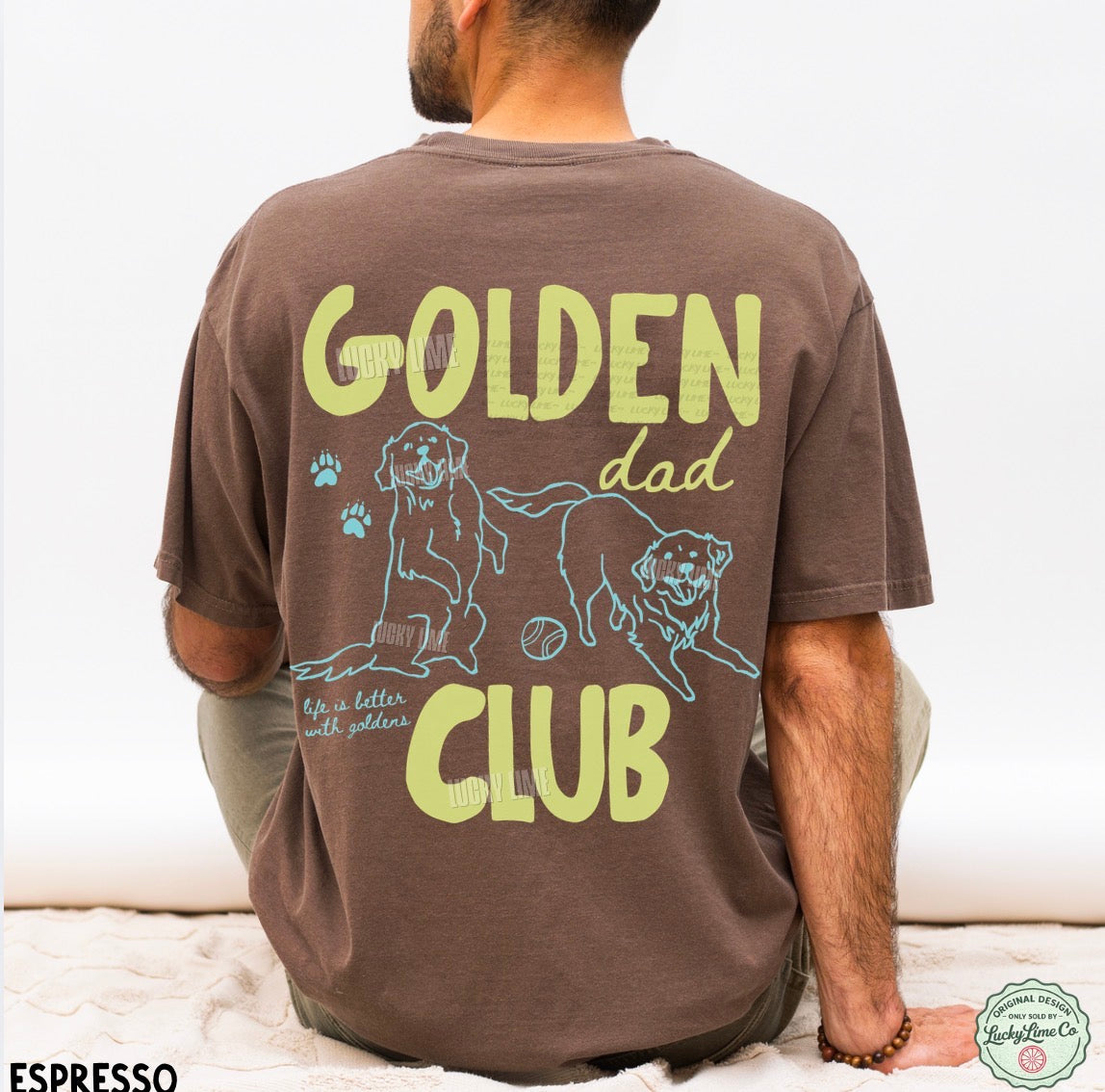 Person wearing a brown t-shirt with 'Golden Dad Club' text and graphics on the back.
