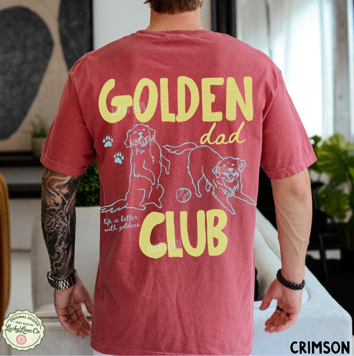 Person wearing a red t-shirt with 'Golden Dad Club' text and graphics.