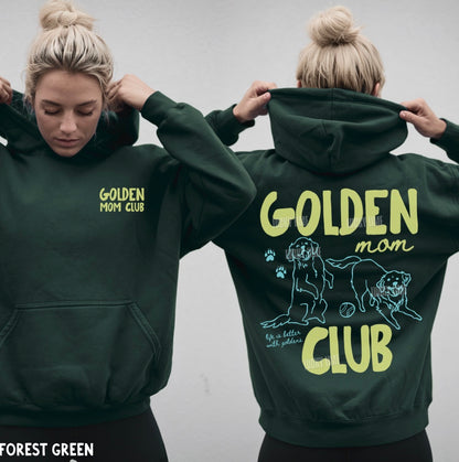 Person wearing a forest green hoodie with 'Golden Mom Club' text and graphic on the back.