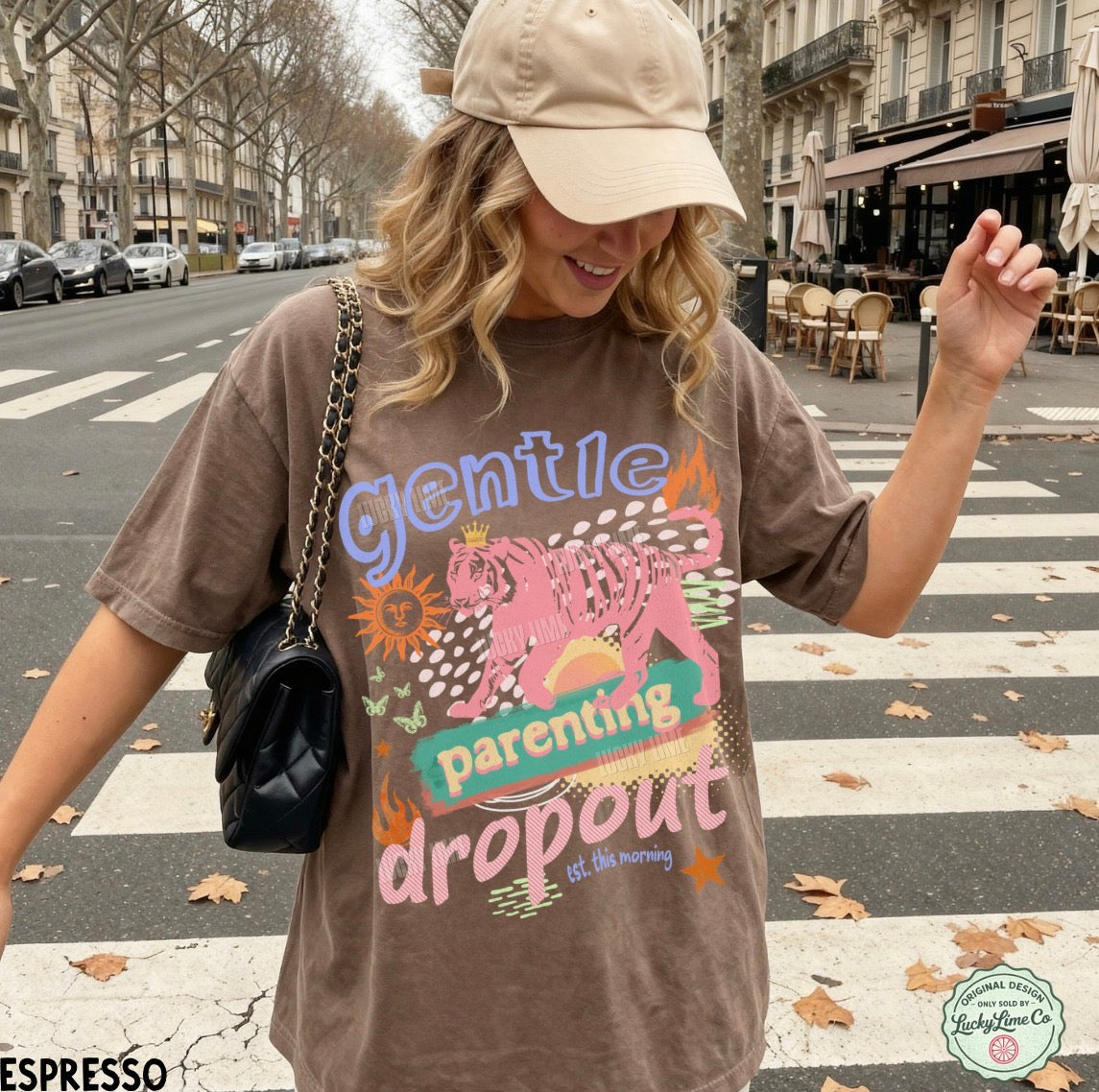 Woman wearing a t-shirt with a graphic design and text on a city street.