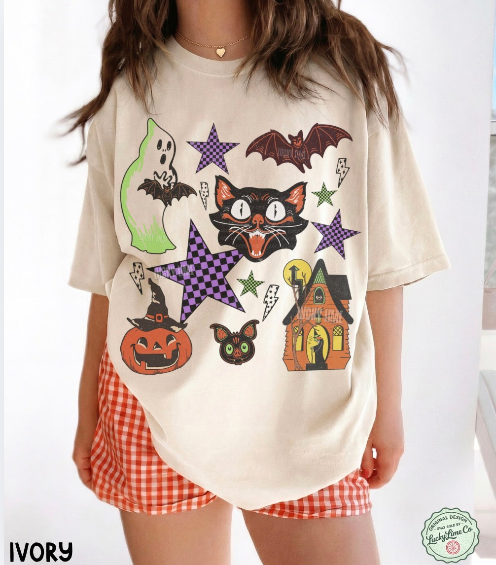 Person wearing a cream t-shirt with Halloween-themed graphics and red checkered shorts.