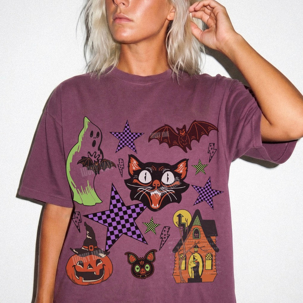 Person wearing a purple t-shirt with Halloween-themed graphics on a white background