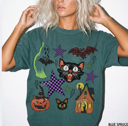 Person wearing a green t-shirt with Halloween-themed graphics